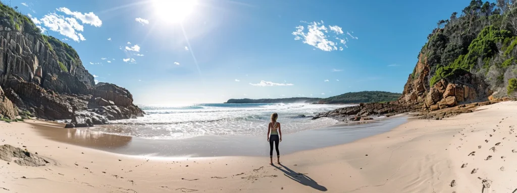 a person standing on a scenic australian beach, gazing out at the horizon with a look of determination and clarity on their face.