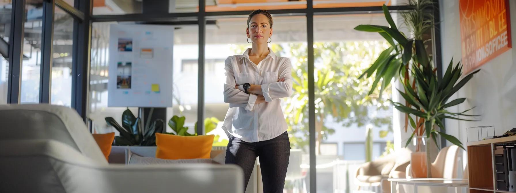 a person standing confidently in a bright, modern office, surrounded by motivational quotes and images of success, symbolizing the transformative power of harnessing the subconscious mind.