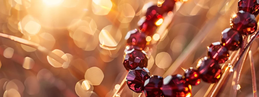 a stunning close-up shot of a deep red garnet bracelet, sparkling in the sunlight against a backdrop of australian outback colors.